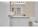 Bathroom with granite countertop, white cabinets, and a toilet at 1575 W Warm Springs Rd # 911, Henderson, NV 89014