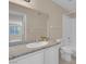 Bathroom with granite countertop, white cabinets, and toilet at 1575 W Warm Springs Rd # 911, Henderson, NV 89014