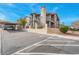 Exterior view of the building with parking and landscaping at 1575 W Warm Springs Rd # 911, Henderson, NV 89014