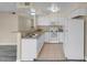 White kitchen with granite countertops and flooring at 1575 W Warm Springs Rd # 911, Henderson, NV 89014