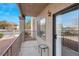 Private patio with metal railing, sliding glass door, and small table at 1575 W Warm Springs Rd # 911, Henderson, NV 89014