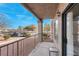 Covered patio with metal railing, sliding glass door, and small table at 1575 W Warm Springs Rd # 911, Henderson, NV 89014