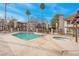 Community pool and spa with surrounding patio and building views at 1575 W Warm Springs Rd # 911, Henderson, NV 89014