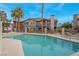 Community pool and spa with building in background at 1575 W Warm Springs Rd # 911, Henderson, NV 89014