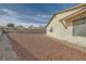 Large backyard area with gravel and brick border at 1688 Crest Ave, Las Vegas, NV 89119