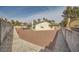 Spacious backyard with gravel landscaping and block wall fencing at 1688 Crest Ave, Las Vegas, NV 89119