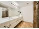 Double vanity bathroom with large mirror and shower at 1688 Crest Ave, Las Vegas, NV 89119