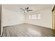 Spacious bedroom with laminate flooring and ceiling fan at 1688 Crest Ave, Las Vegas, NV 89119