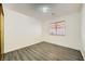 Bedroom with wood-look floors and window at 1688 Crest Ave, Las Vegas, NV 89119