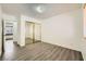 Bedroom with mirrored closet doors and wood-look floors at 1688 Crest Ave, Las Vegas, NV 89119