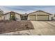 Single-story house with a two-car garage and landscaped front yard at 1688 Crest Ave, Las Vegas, NV 89119