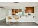 Kitchen with breakfast bar and white quartz countertops at 1688 Crest Ave, Las Vegas, NV 89119