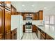 Modern kitchen featuring stainless steel appliances and wood cabinetry at 1688 Crest Ave, Las Vegas, NV 89119