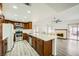 Spacious kitchen with island, stainless steel appliances, and wood cabinets at 1688 Crest Ave, Las Vegas, NV 89119