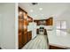 Modern kitchen with white countertops and wood cabinets at 1688 Crest Ave, Las Vegas, NV 89119