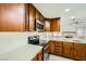 Modern kitchen with wood cabinets and quartz counters at 1688 Crest Ave, Las Vegas, NV 89119