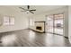 Bright living room with fireplace and sliding glass doors to patio at 1688 Crest Ave, Las Vegas, NV 89119