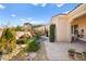 Landscaped backyard with stone pathway and plants at 2 Lago Turchino Ct, Henderson, NV 89011