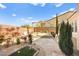 Landscaped backyard with patio and seating area at 2 Lago Turchino Ct, Henderson, NV 89011