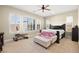 Spacious Primary bedroom with large windows and plush bedding at 2 Lago Turchino Ct, Henderson, NV 89011