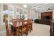 Breakfast nook with wooden table and chairs near kitchen at 2 Lago Turchino Ct, Henderson, NV 89011