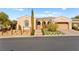 Single-story home with a 2-car garage and stone accents at 2 Lago Turchino Ct, Henderson, NV 89011