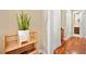 Bright hallway with wood floors and a plant on a shelf at 2 Lago Turchino Ct, Henderson, NV 89011