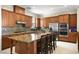 Kitchen with granite countertops, stainless steel appliances, and wood cabinets at 2 Lago Turchino Ct, Henderson, NV 89011