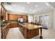 Modern kitchen with granite island, stainless steel appliances, and ample cabinetry at 2 Lago Turchino Ct, Henderson, NV 89011