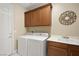 Laundry room with washer, dryer, and cabinets at 2 Lago Turchino Ct, Henderson, NV 89011