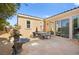 Stone patio with seating area and fountain at 2 Lago Turchino Ct, Henderson, NV 89011