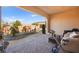 Covered patio with seating area and exercise bike at 2 Lago Turchino Ct, Henderson, NV 89011