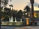 Evening view of community fountain and entrance at 2050 W Warm Springs Rd # 712, Henderson, NV 89014