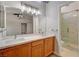 Bathroom featuring a double vanity, updated countertops, and a separate shower, offering style and convenience at 2177 Bridle Wreath Ln, Las Vegas, NV 89156