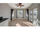 Bright breakfast nook with tile floors, ceiling fan, and access to the backyard through sliding glass doors at 2177 Bridle Wreath Ln, Las Vegas, NV 89156