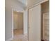 Hallway view highlighting the neutral color palette and tile flooring, creating a seamless transition between spaces at 2177 Bridle Wreath Ln, Las Vegas, NV 89156