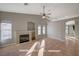 Open living room with tile flooring, fireplace and open archways at 2177 Bridle Wreath Ln, Las Vegas, NV 89156