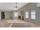 Open concept living room with tile flooring, a fireplace, and natural light at 2177 Bridle Wreath Ln, Las Vegas, NV 89156