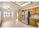 Bright eat-in kitchen with stainless steel refrigerator and ample cabinet space at 2520 Palmridge Dr, Las Vegas, NV 89134