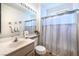 Clean bathroom with a single sink, toilet, and shower/tub combo at 2612 Harrisburg Ave, Henderson, NV 89052