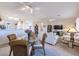 Open living room and kitchen with an adjoining dining area and plenty of natural light at 2612 Harrisburg Ave, Henderson, NV 89052