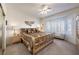 Spacious main bedroom with a large bed, plenty of light from a bay window, and built-in shelving at 2612 Harrisburg Ave, Henderson, NV 89052