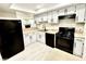 Modern kitchen with black appliances and light cabinets at 2631 Aracatuba Ave, Las Vegas, NV 89121