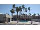 Community pool surrounded by mature palm trees at 2631 Aracatuba Ave, Las Vegas, NV 89121