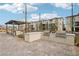 Outdoor kitchen area with grills and covered seating at 2669 Champagne Gold Ave, North Las Vegas, NV 89086