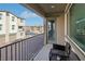 Small balcony with seating for two and views of the community at 2669 Champagne Gold Ave, North Las Vegas, NV 89086