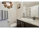 Clean bathroom with granite countertop, toilet, and shower/tub combo at 2669 Champagne Gold Ave, North Las Vegas, NV 89086