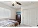 Bedroom with ceiling fan, window blinds, and double door closet at 2669 Champagne Gold Ave, North Las Vegas, NV 89086