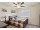 Bedroom with ceiling fan, window blinds and a plaid comforter at 2669 Champagne Gold Ave, North Las Vegas, NV 89086