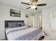 Main bedroom with ceiling fan and ensuite bathroom at 2669 Champagne Gold Ave, North Las Vegas, NV 89086